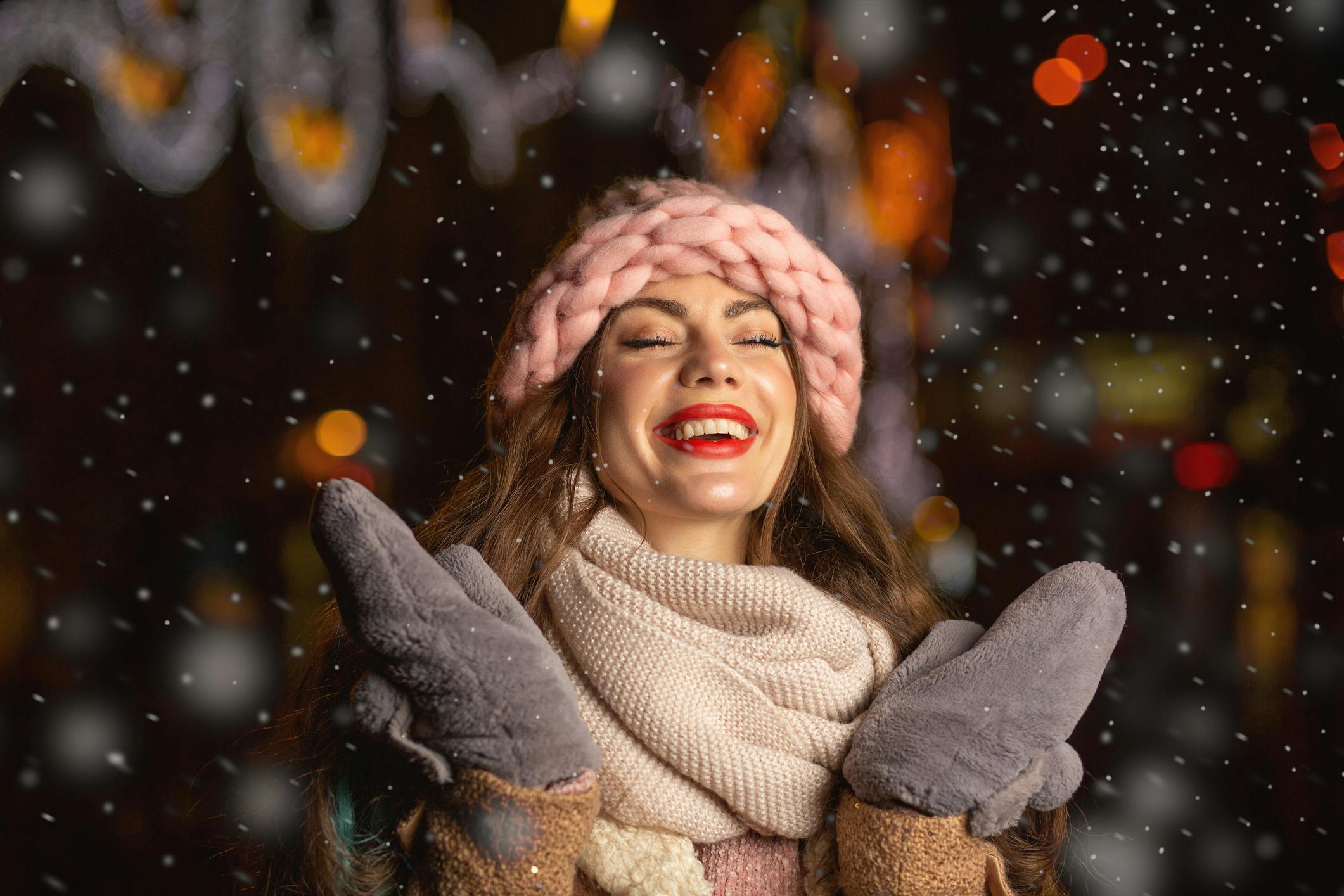 woman smiling while snowing
