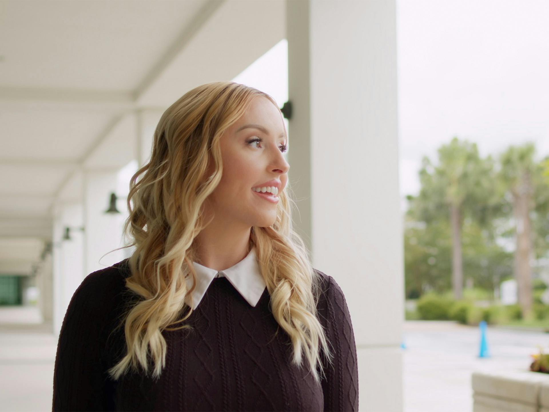 Blonde woman in knitted sweater