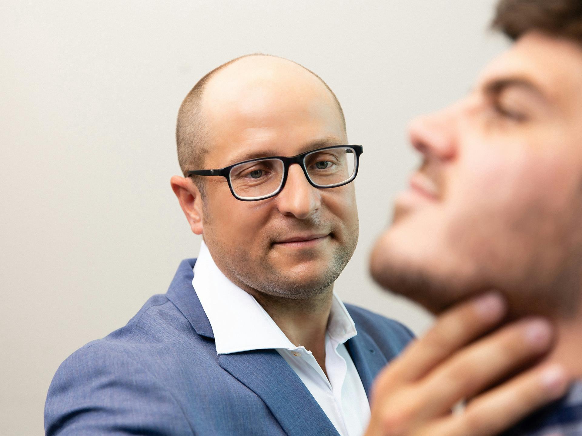 Dr. Michael DeFazio examining male patient