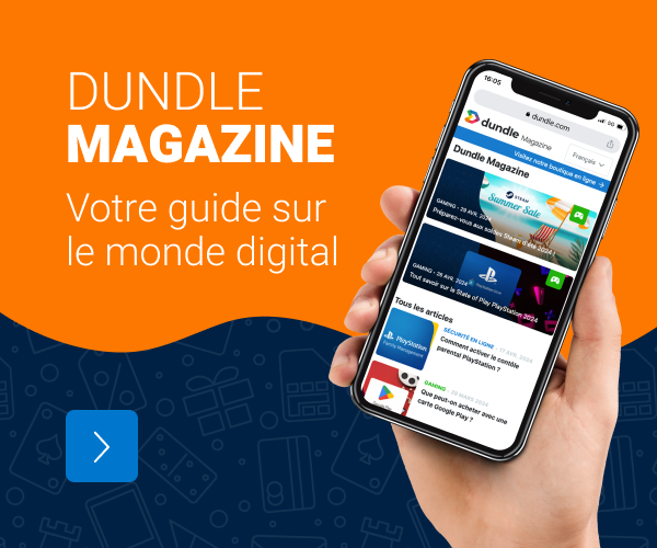 Une main tenant un téléphone portable s'est ouverte sur la page du magazine dundle sur fond orange et bleu.
