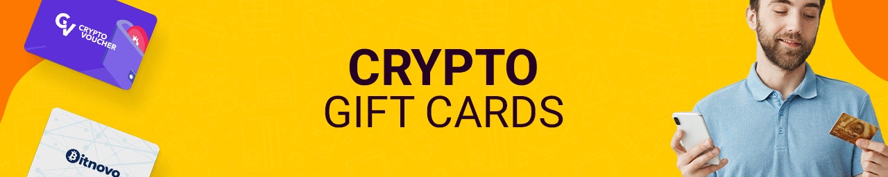 Crypto Gift Cards banner A Yellow Banner with crypto gift cards floating on the left and a man holding a phone and card on the right