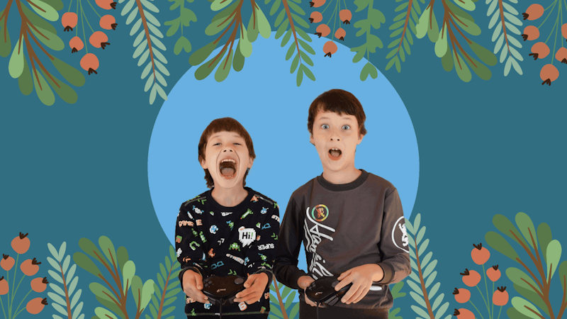 Two kids excited with controllers in their hands with a Christmas theme.