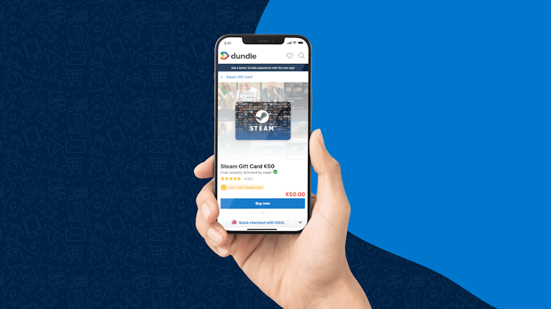 Une main tenant un smartphone. Sur l'écran apparaît le site dundle et la page d'achat d'une carte cadeau numérique Steam.