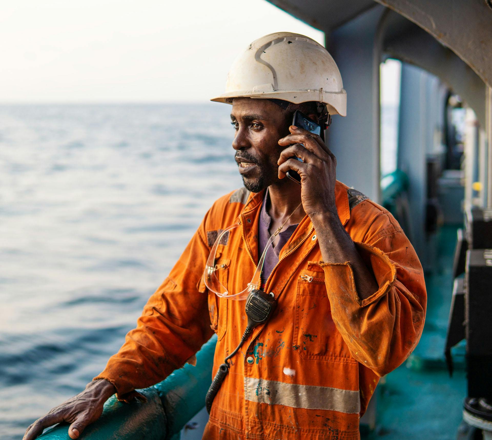 Ship crewmember on a phone call
