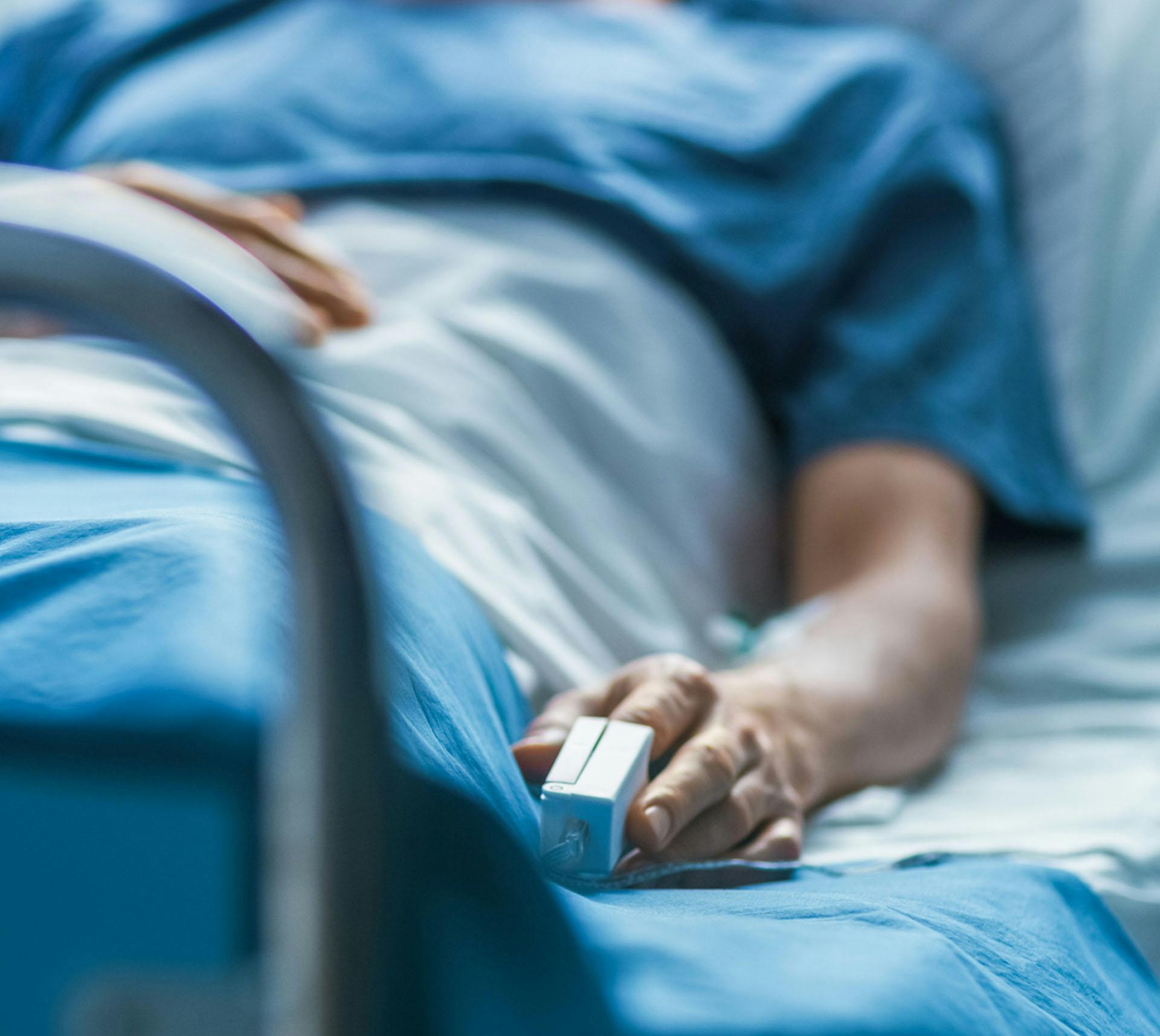 Patient lying on hospital bed