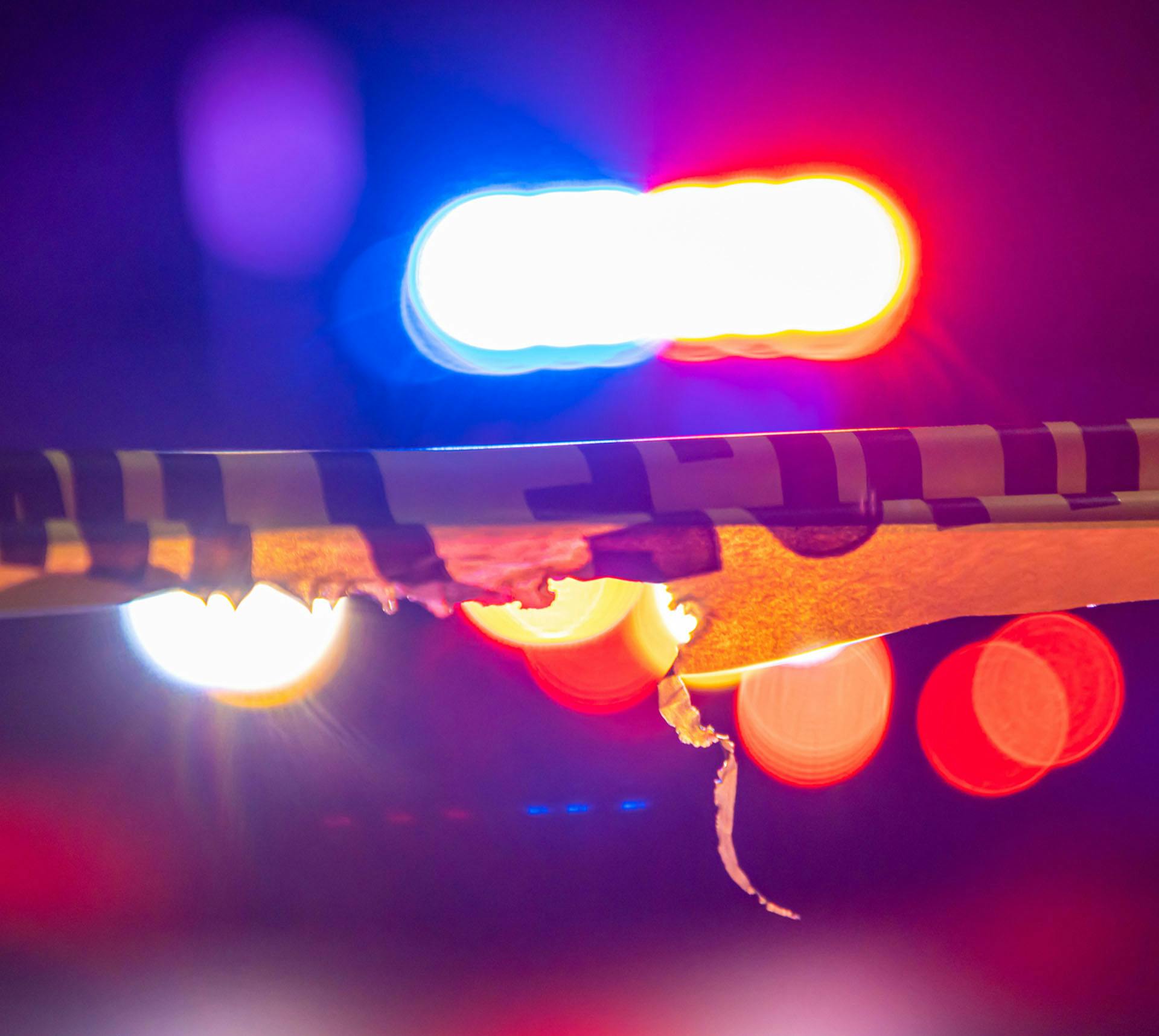 Caution tape and police lights