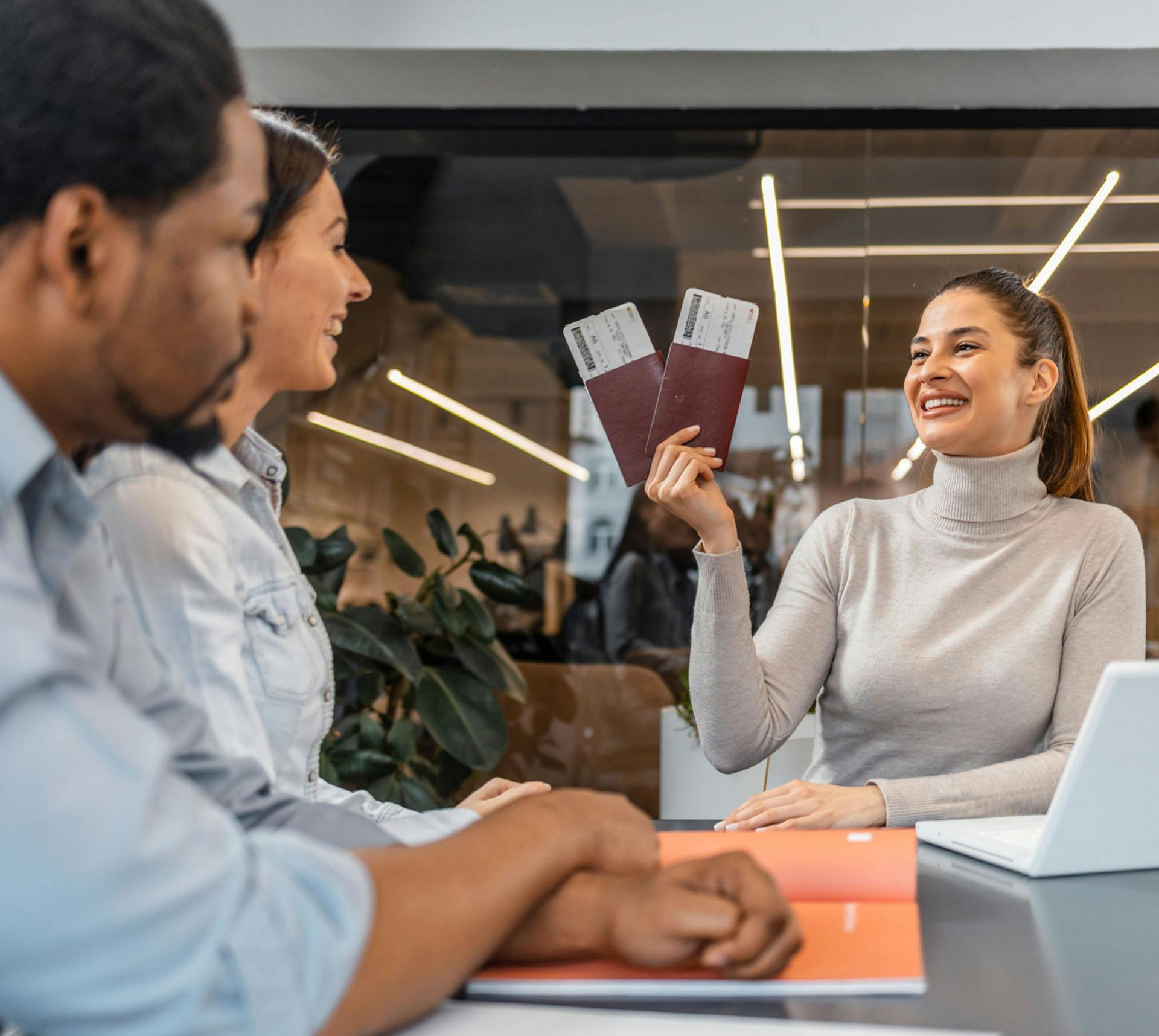 Woman holding boarding passes