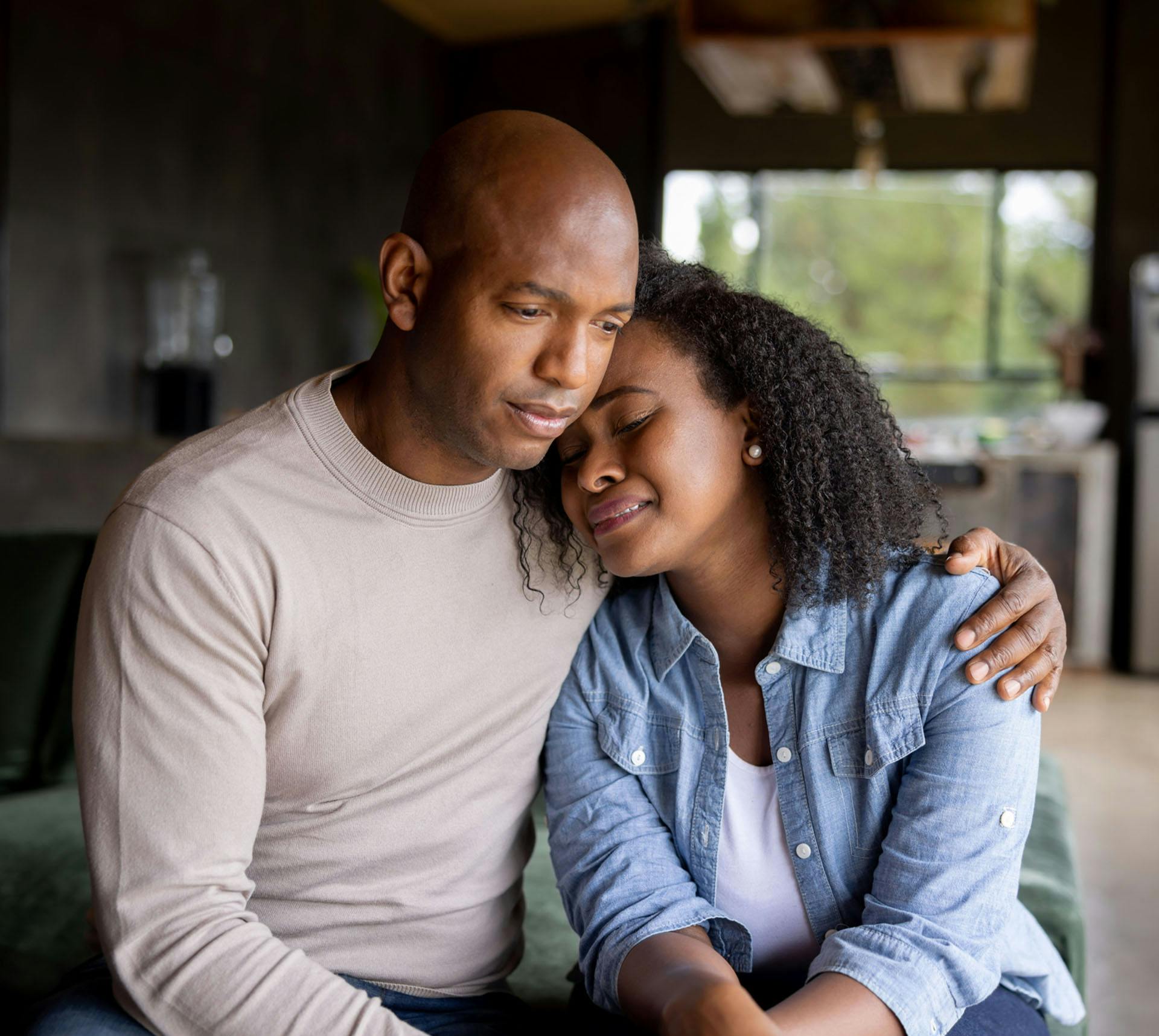 Man holding upset woman