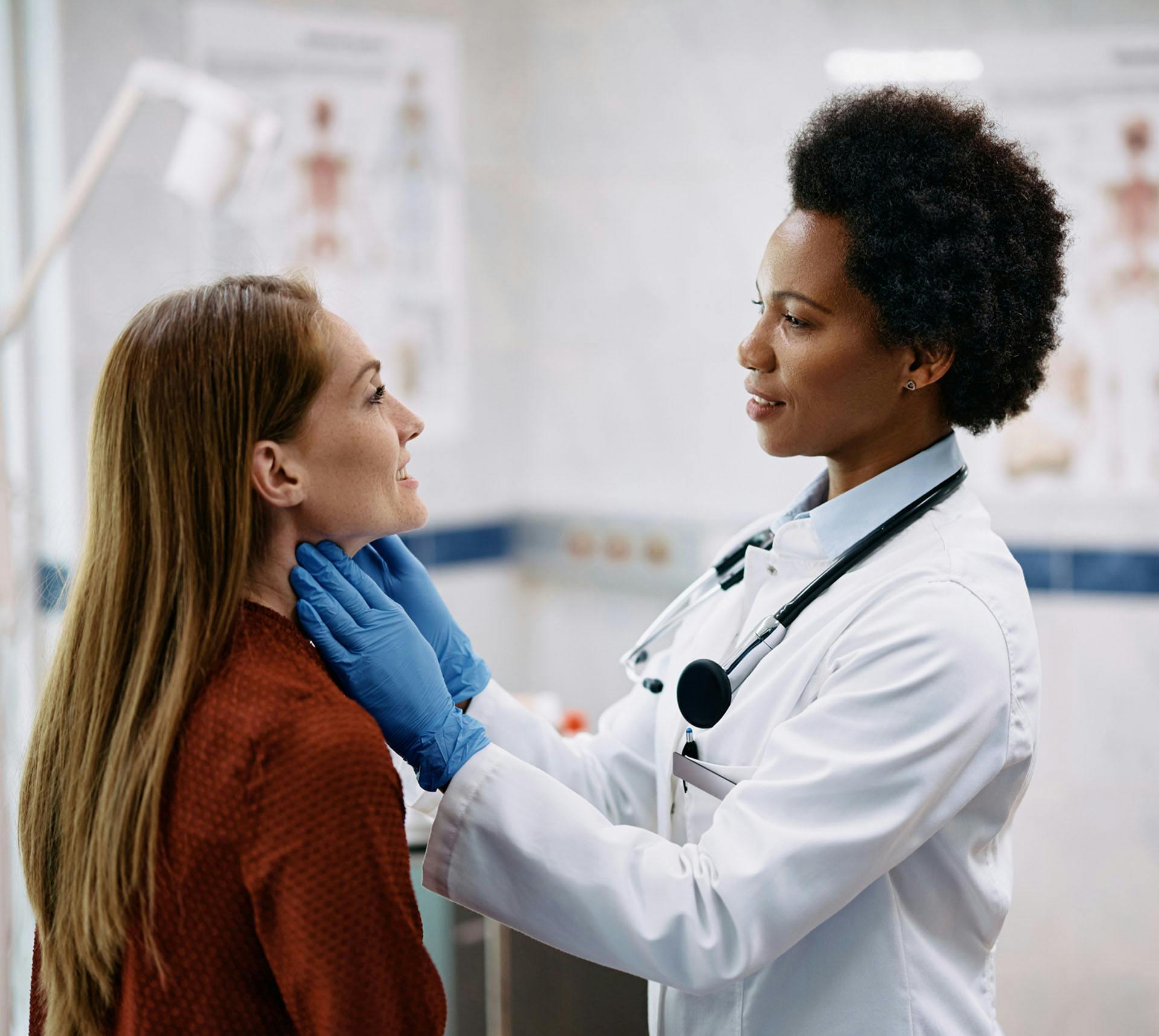 Doctor checking patient's throat
