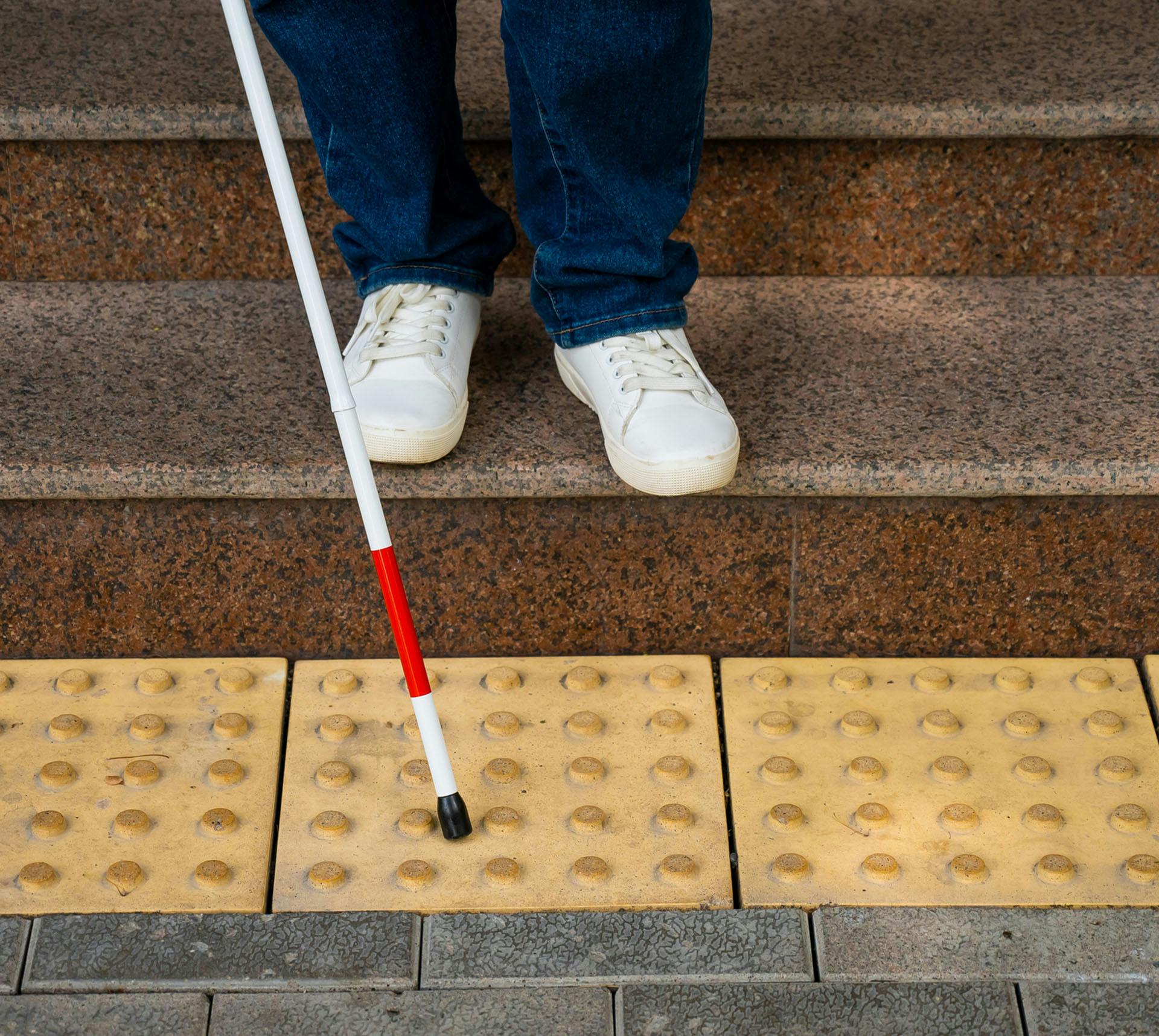 Visual impaired person using a walking stick