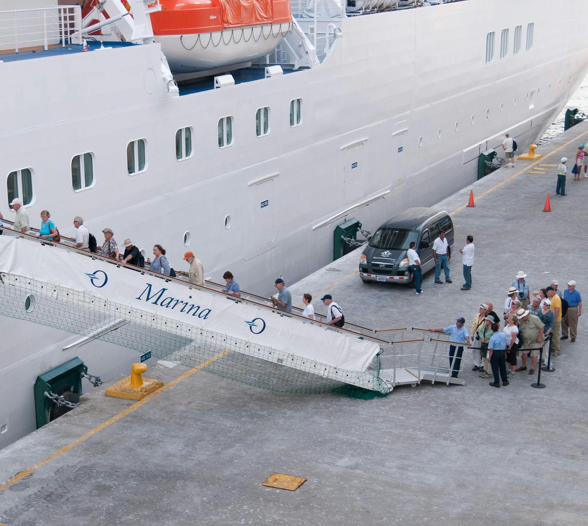 People boarding cruise ship