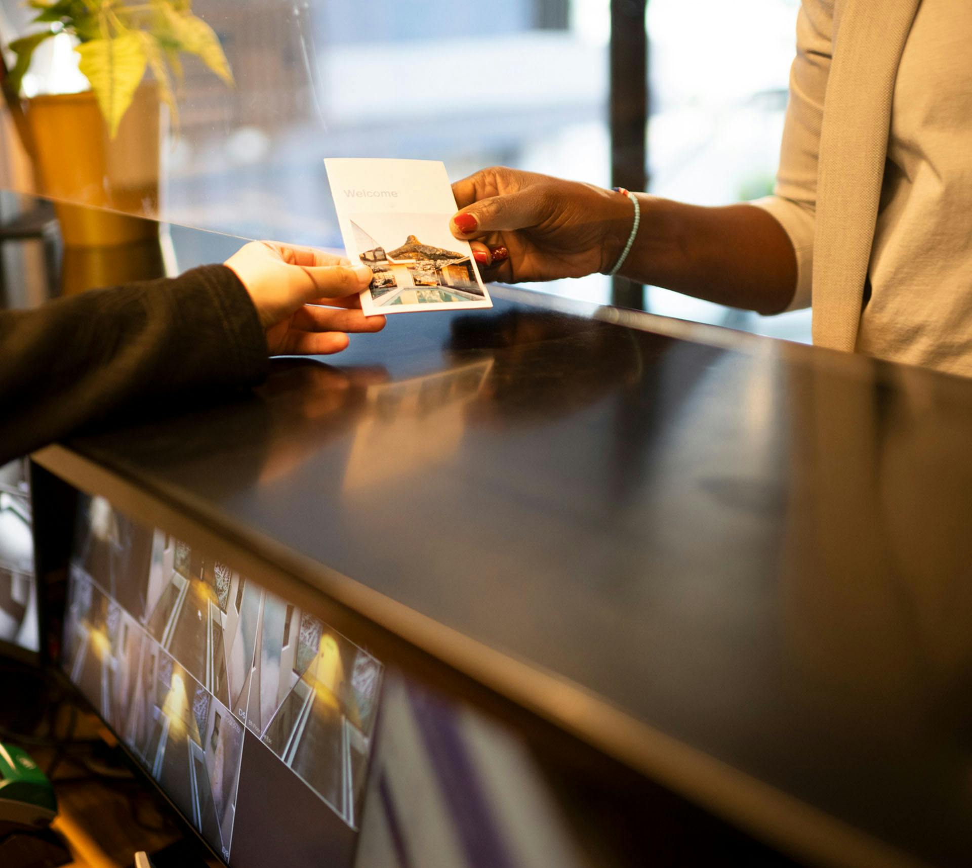 Person receiving card from staff