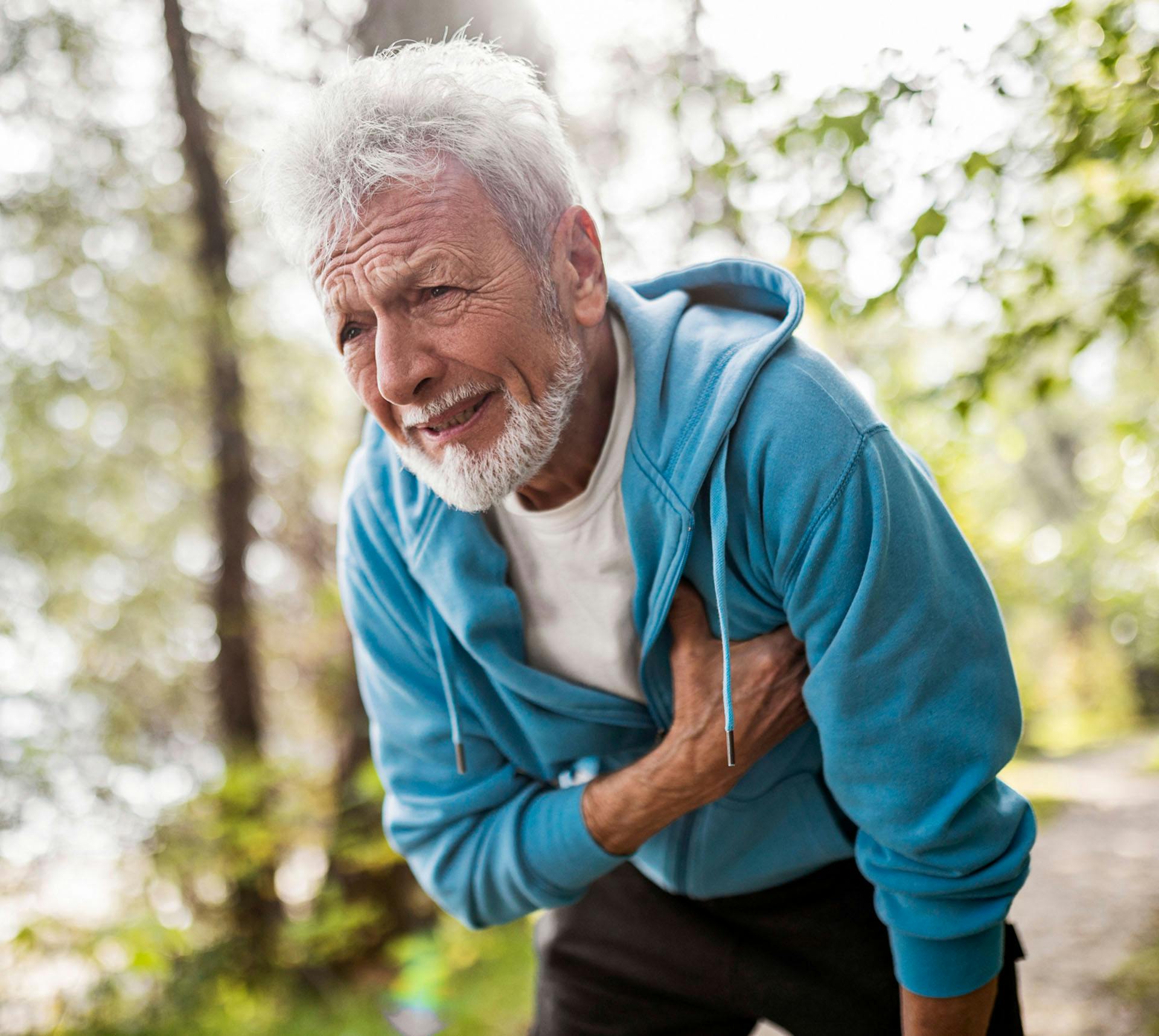 Old man clutching his chest