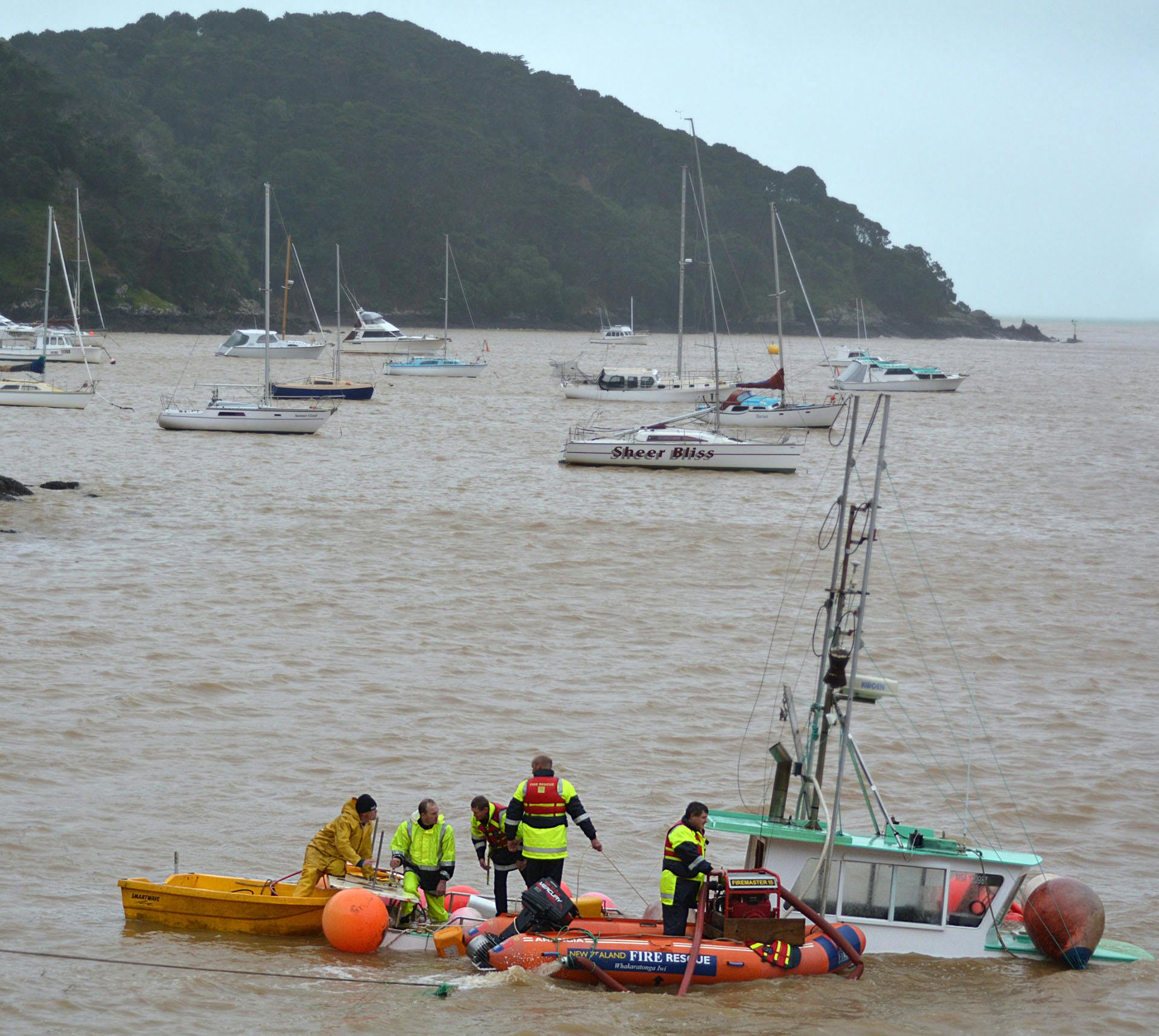 Rescue team helping at a sinking boat