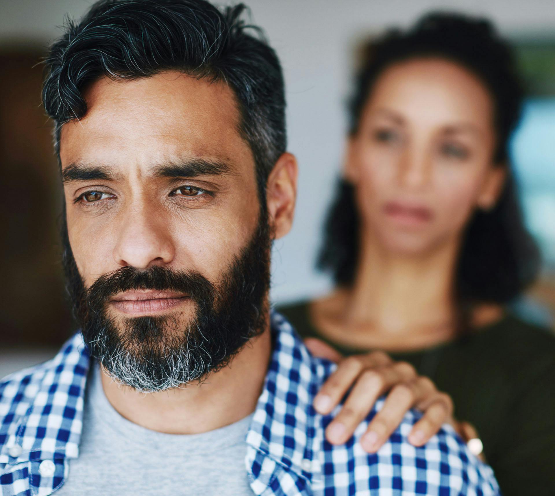 Woman trying to comfort upset man