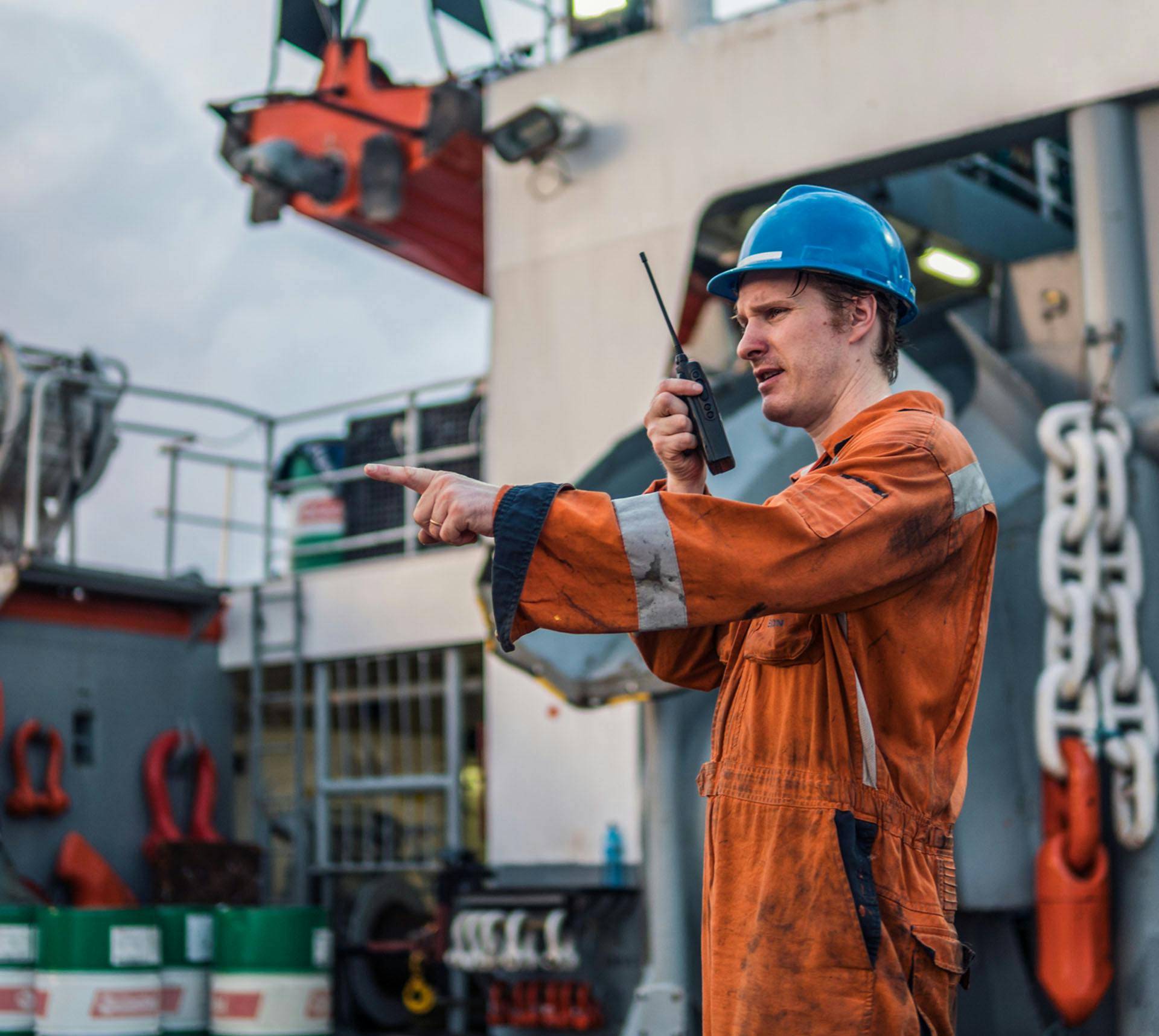 Seaman speaking in walkie-talkie