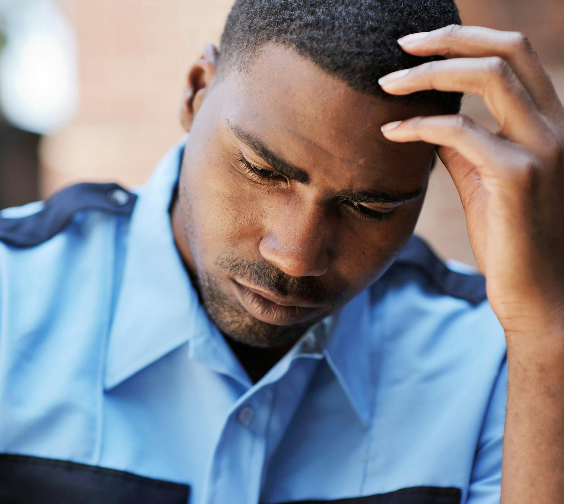 Man resting hand on forehead concerned