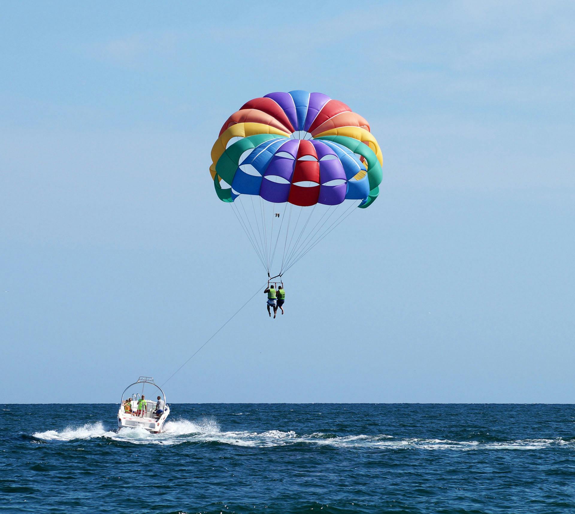 Two people parasailing