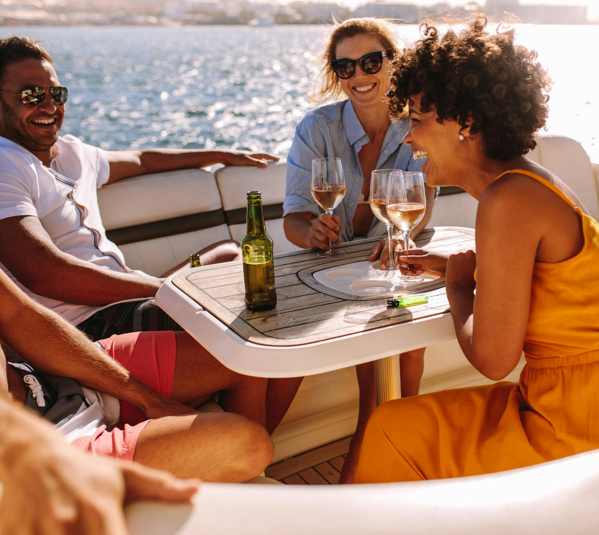 Group of friends laughing together at a table