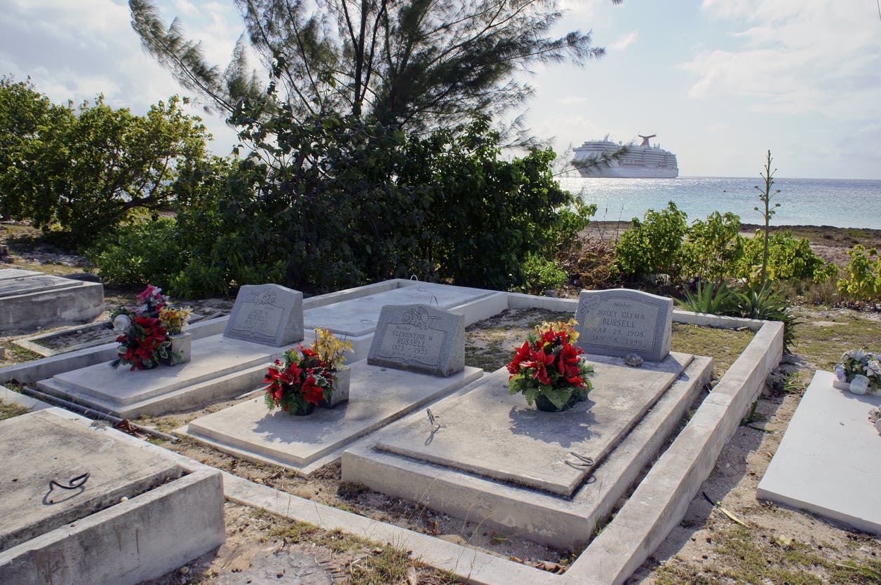 Cemetary with cruise ship in background.