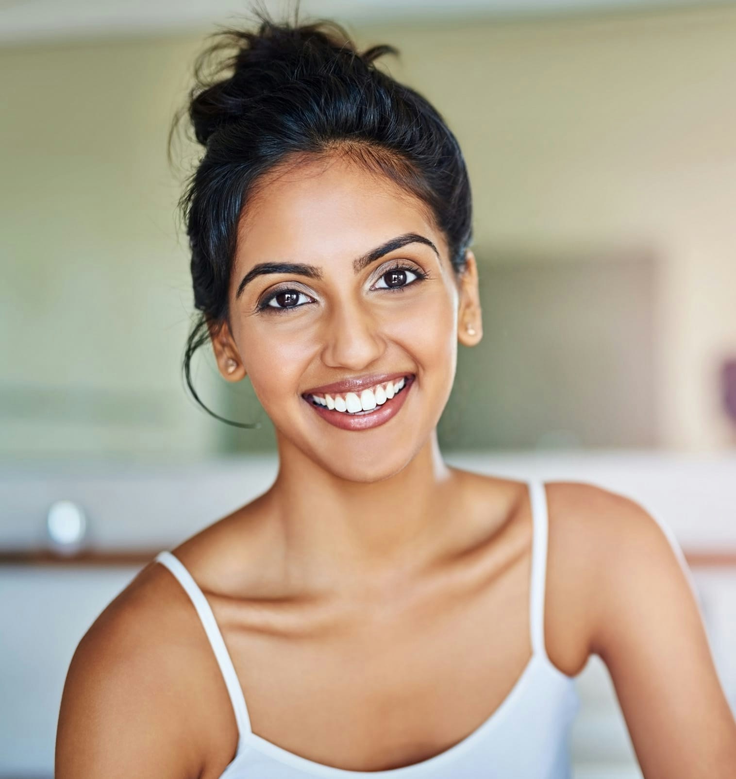 smiling woman in white cami