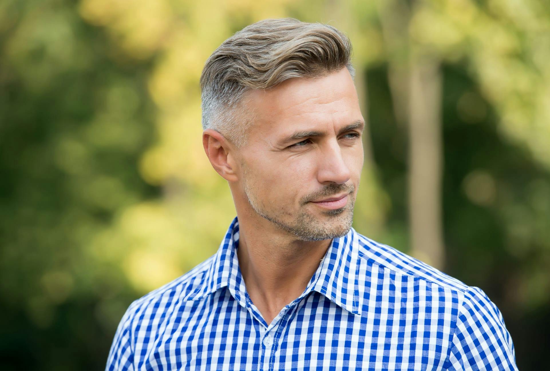 Man in white and blue button up shirt