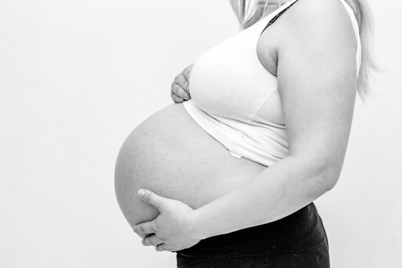 Black and white picture of pregnant woman