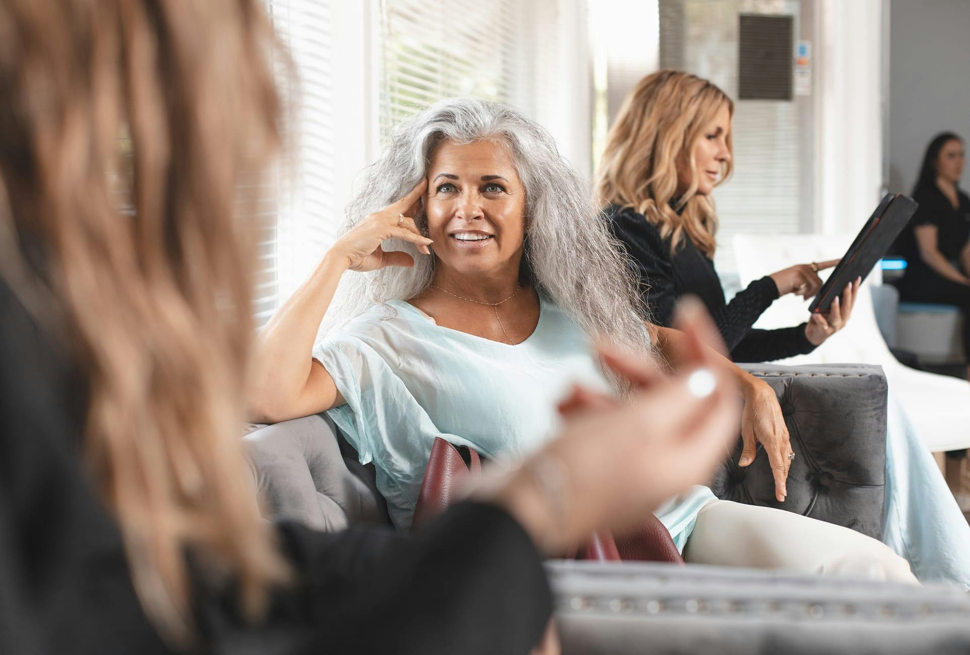 Patient at Hera Health Care speaking with another woman