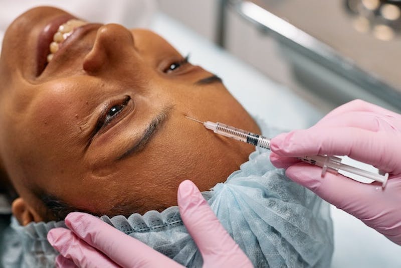 patient is getting a injection from a nurse