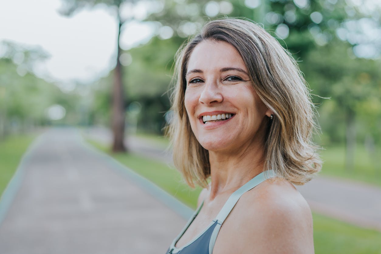 woman smiling outdoors