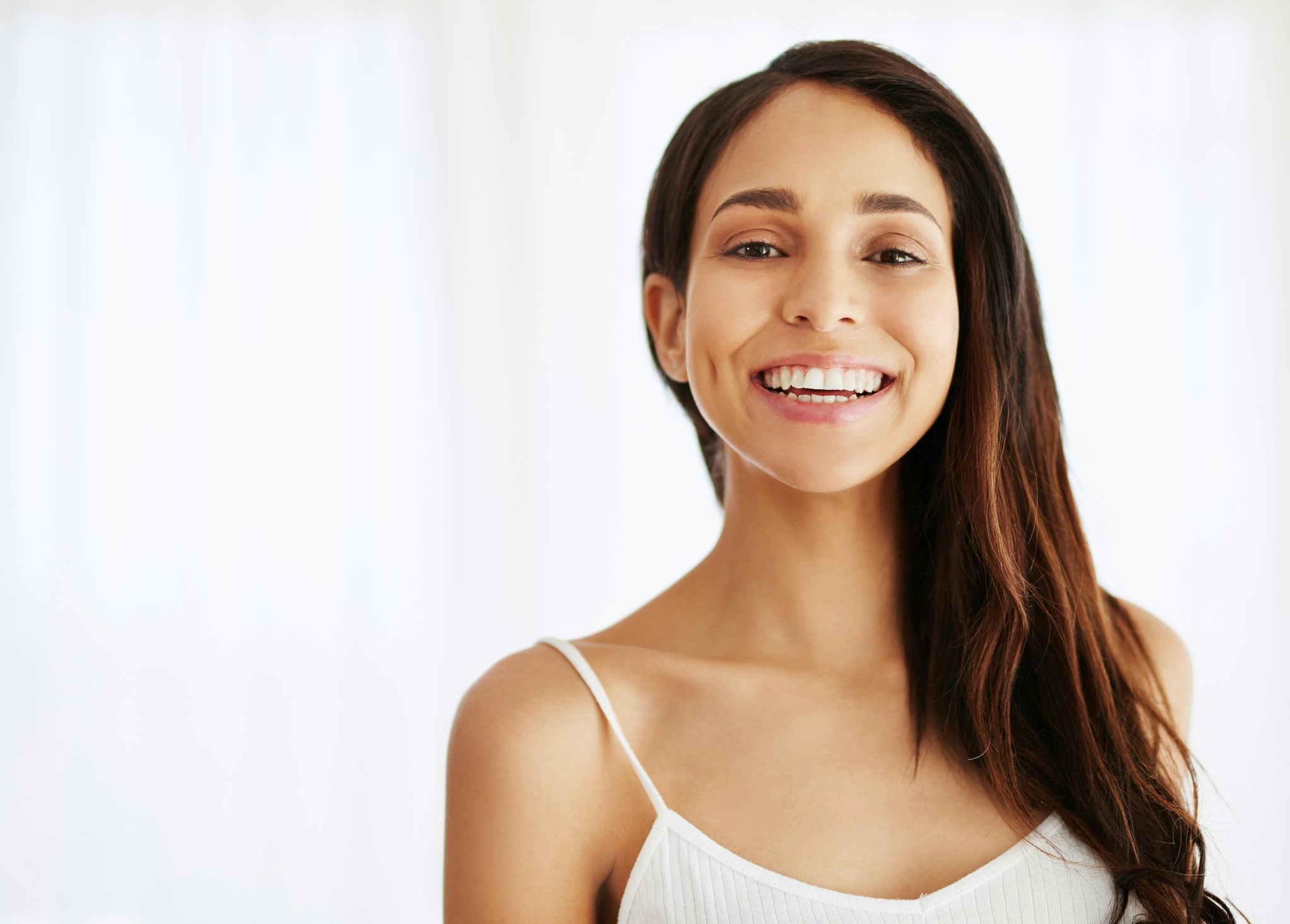 woman with long brown hair smiling