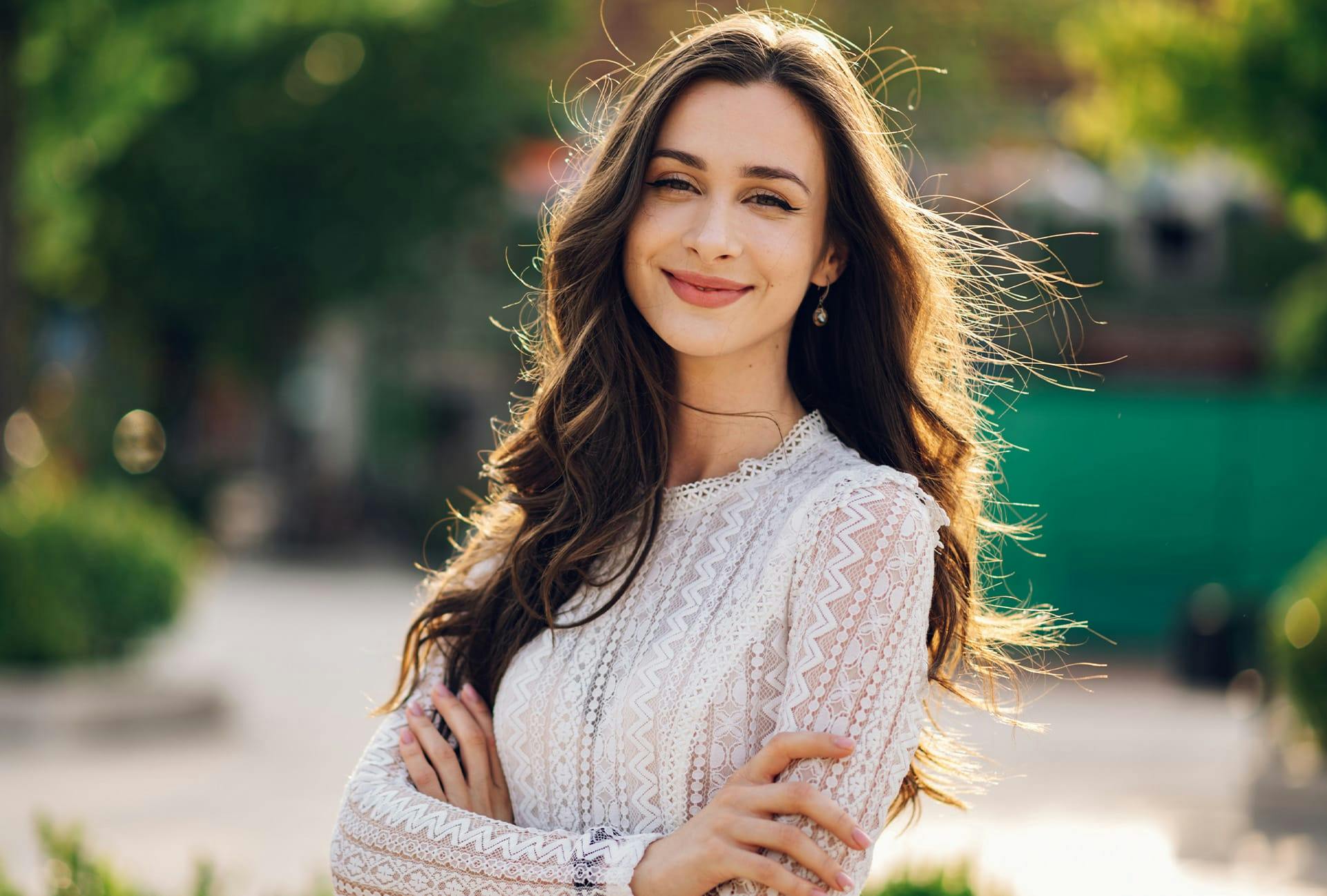 Woman smiling with arms crossed