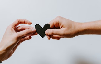 Human hands holding a heart