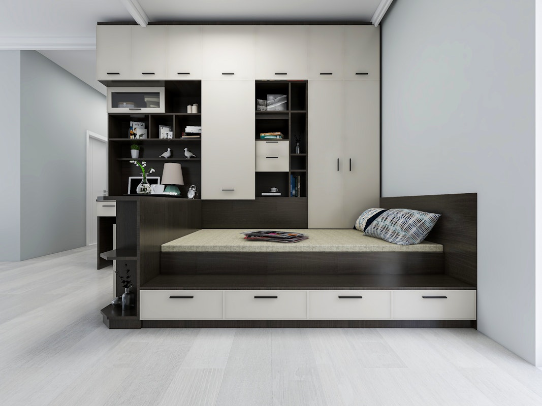 Elegant and spacious bedroom design in modern apartment, desk beside big bed