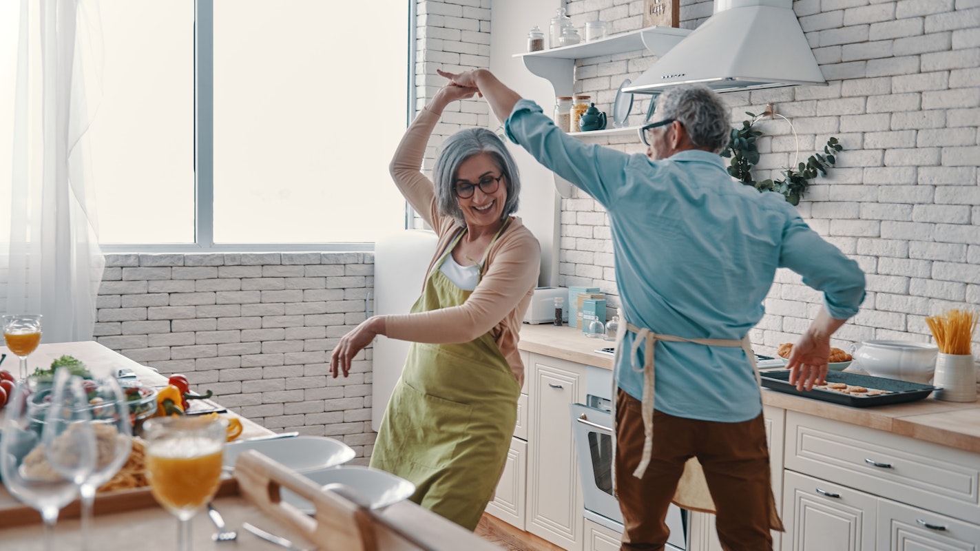 Couple dancing in a kitchen they love