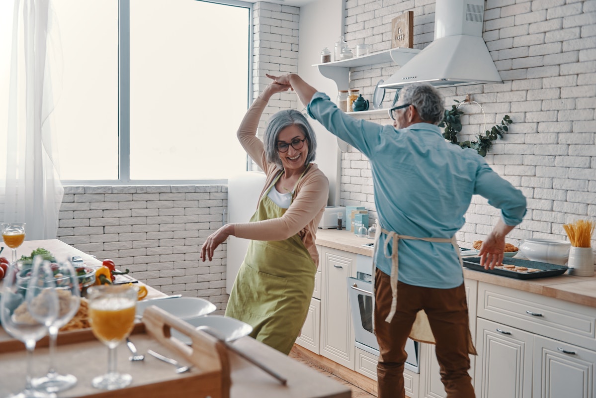 Couple dancing in a kitchen they love