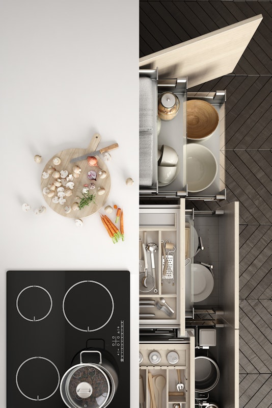 Top view of a kitchen counter with cabinets open