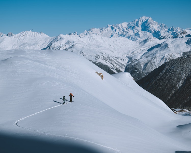 Ski touring for two amid snowy landscapes in Courchevel