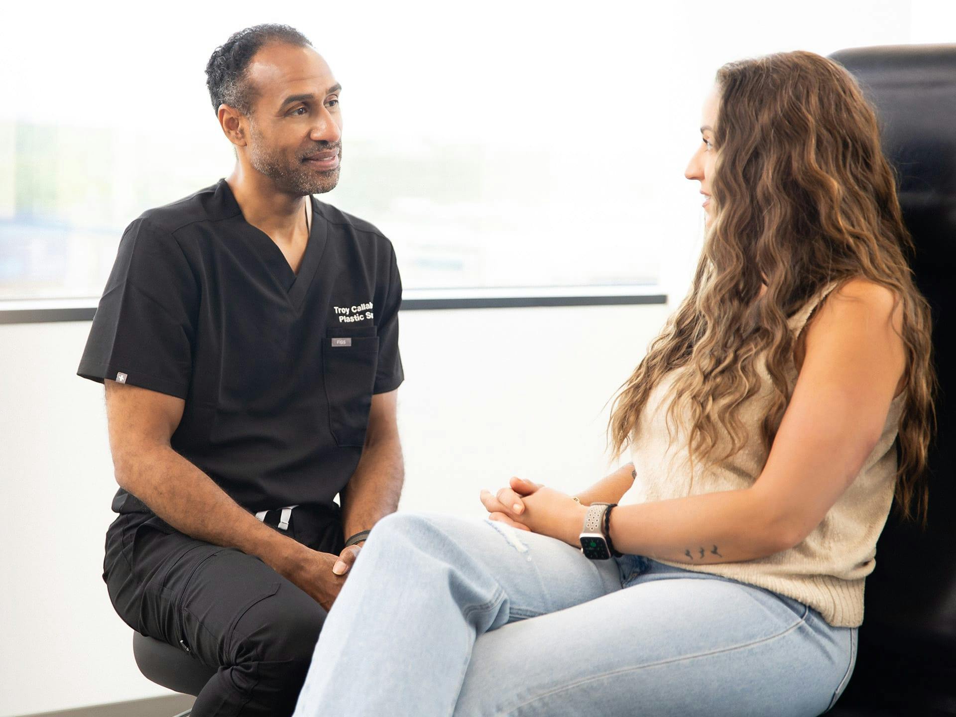 Woman patient speaking with Dr Troy Callahan.