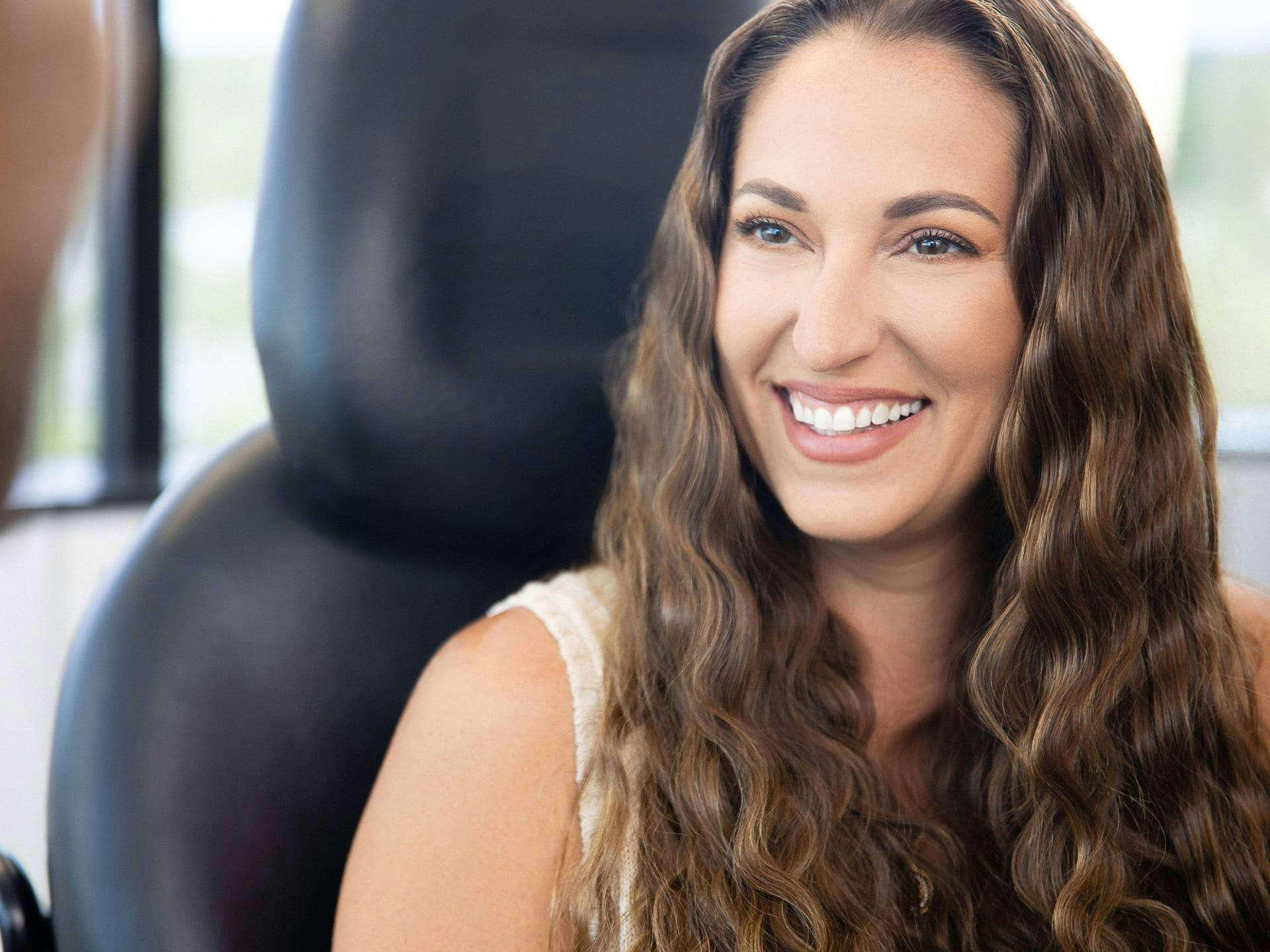 Smiling woman in an office chair