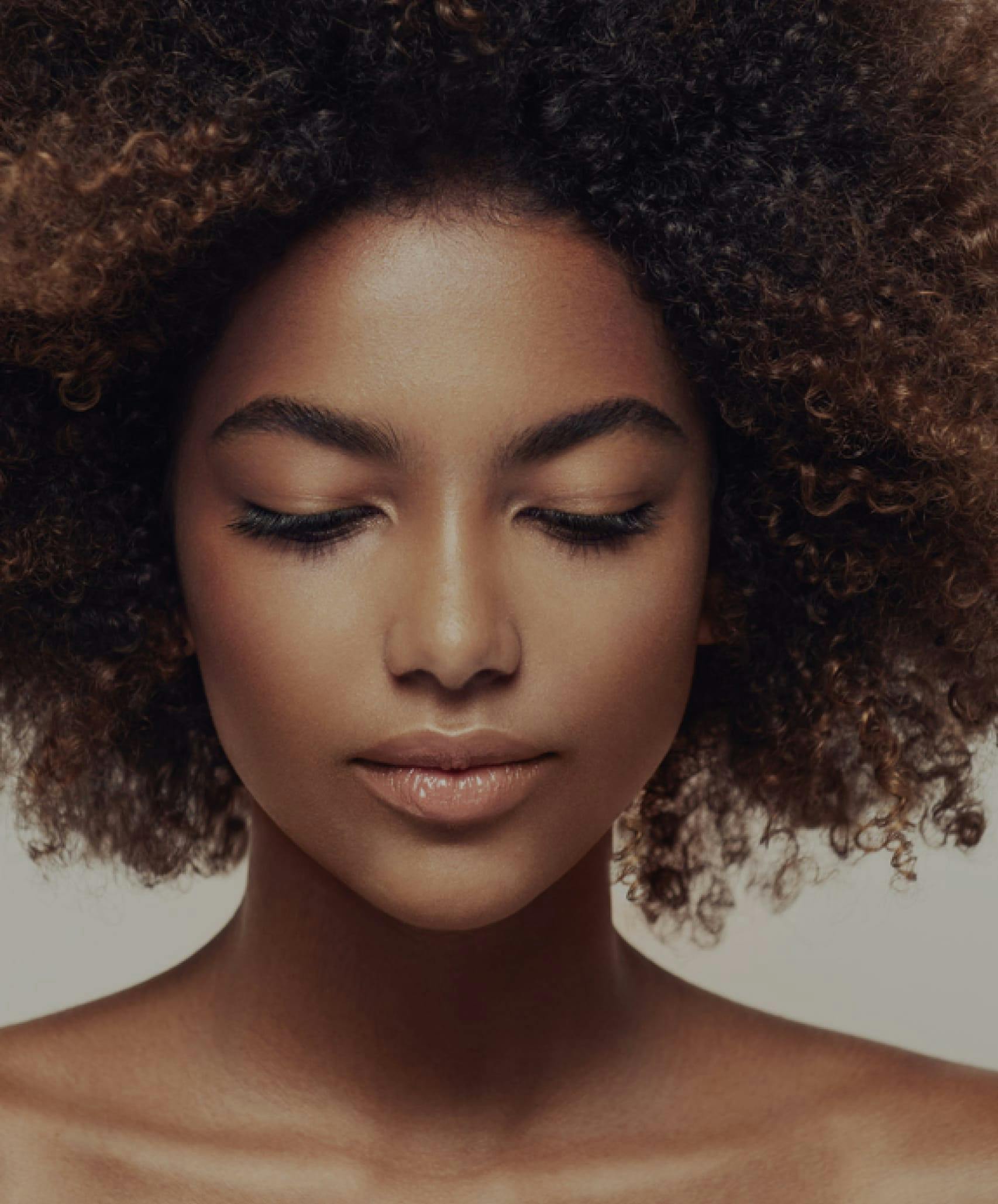 Woman with her eyes closed.