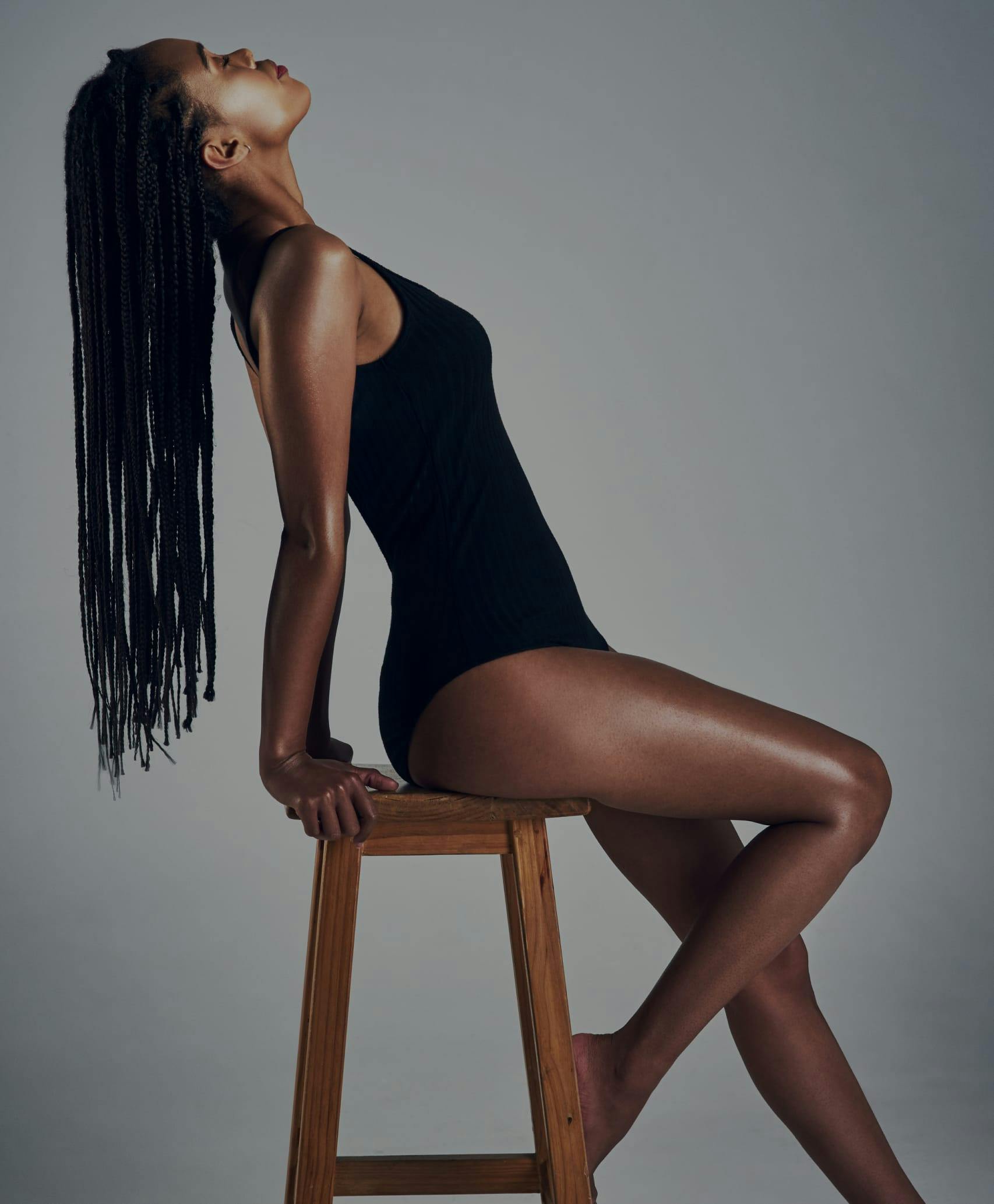 Woman with long hair posing in a bathing suit.