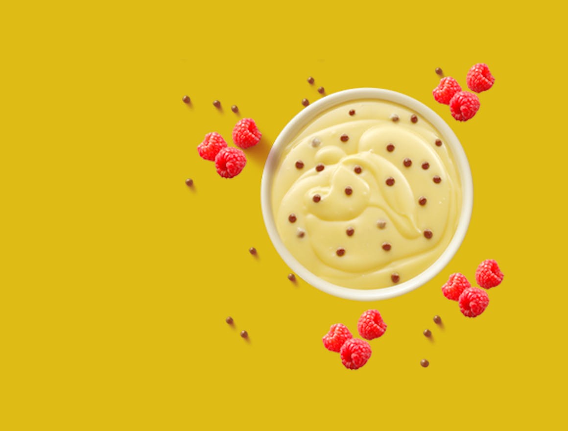 Melkunie bolletjes vanille vla met verse framboosjes.