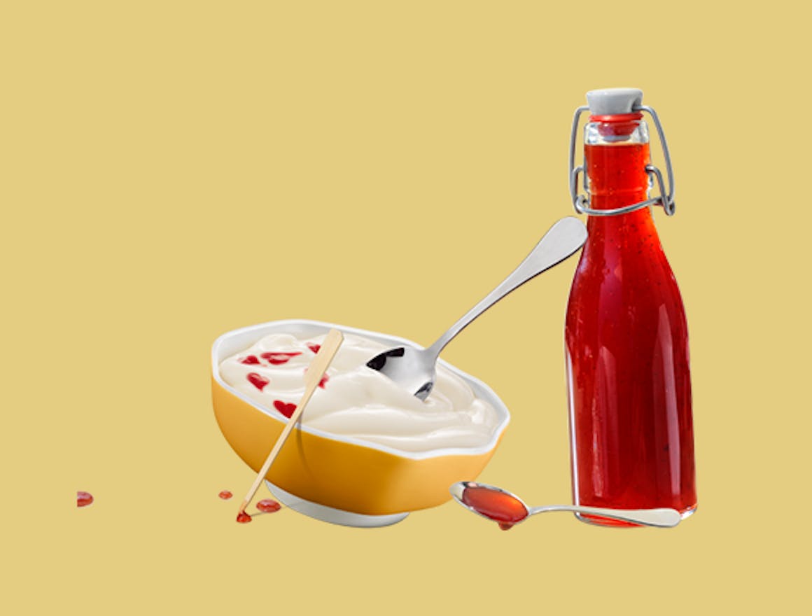 Melkunie blanke vla met jam of siroop.