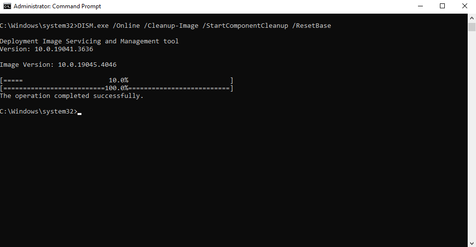 A command prompt window showing the successful execution of a DISM command with the /ResetBase option to clean up the Windows image.