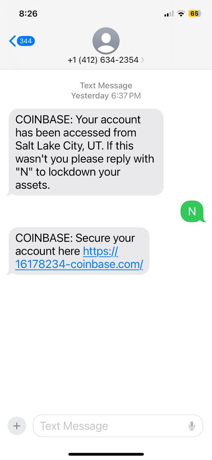 A screenshot of a mobile phone receiving a suspected phishing SMS message claiming to be from Coinbase, prompting an action to secure the account.