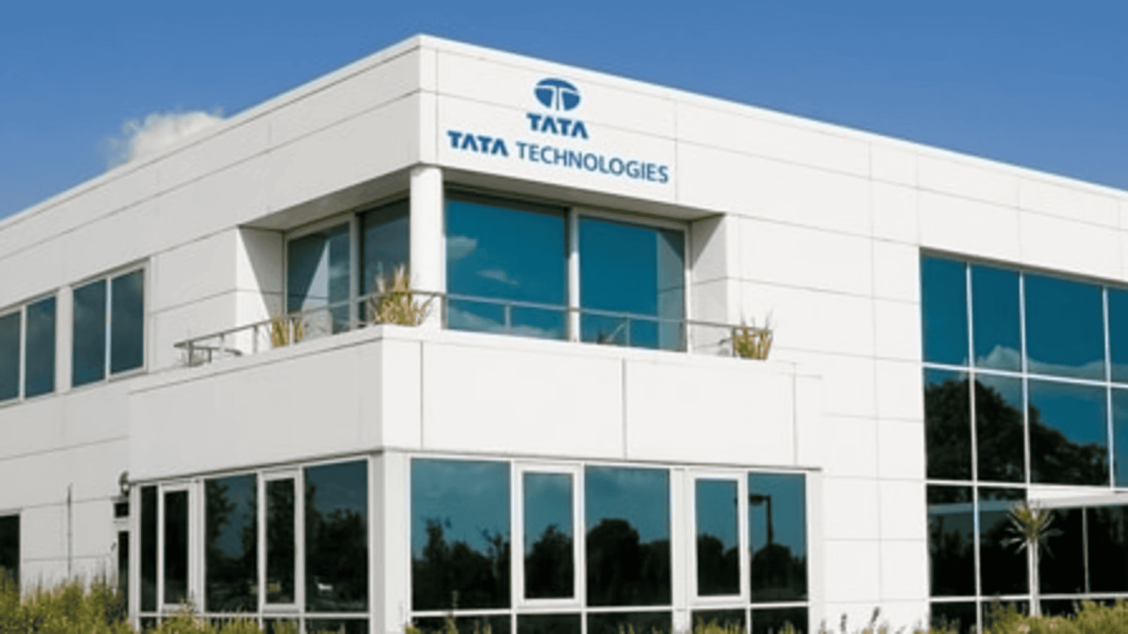 A modern office building with Tata Technologies branding on its exterior.