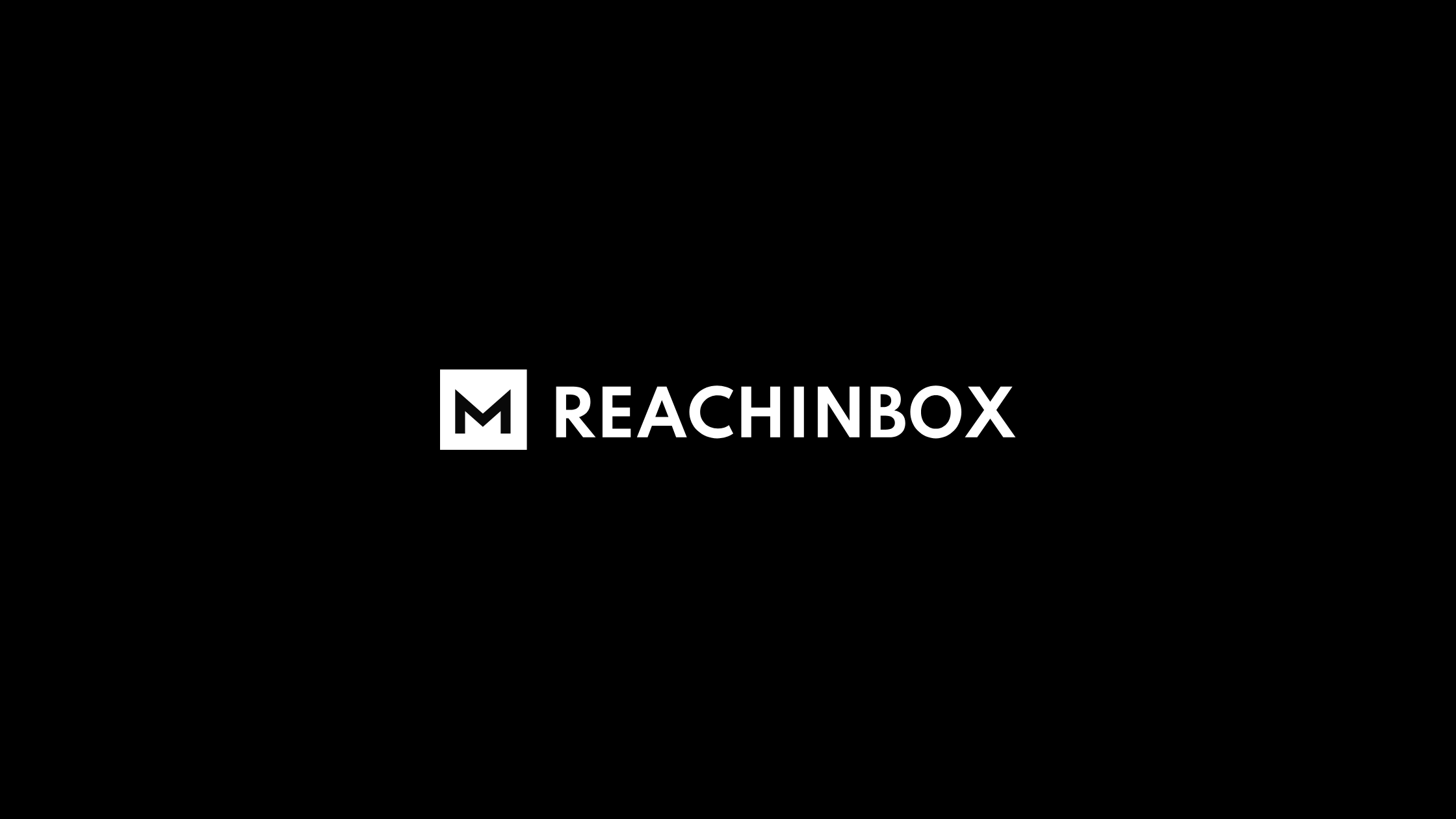 Logo of ReachInbox featuring a bold white “M” icon inside a square next to the text “REACHINBOX” on a black background.