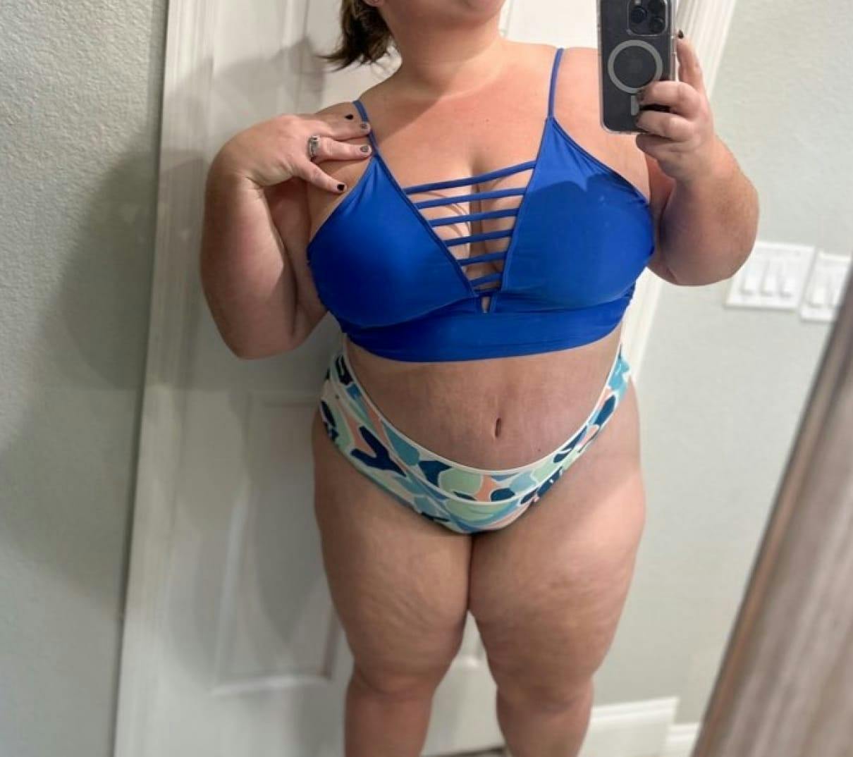 Midsection of a woman in a blue top