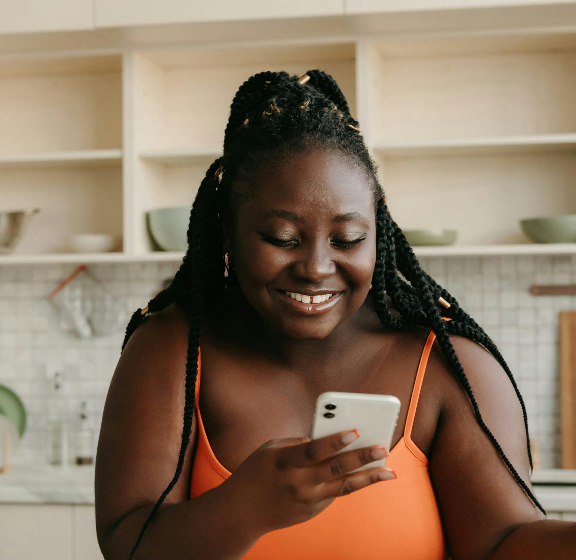 woman on her phone smiling